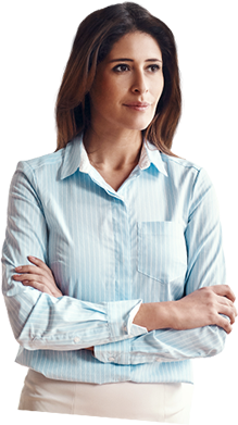 Woman staring into the distance with arms folded